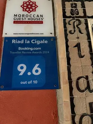 a sign for a riedel la gielle building at Riad la Cigale in Marrakech