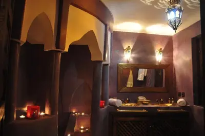 a bathroom with a sink and a mirror at Riad Imilchil in Marrakech