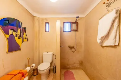 a bathroom with a toilet and a shower at Maison Du Tresor in Marrakech