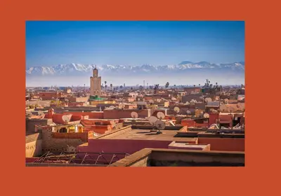 a view of a city with mountains in the background at Marrakech autrement in Marrakech