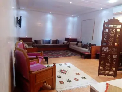 a living room with a couch and chairs and a table at Marrakech autrement in Marrakech
