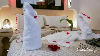 a bed with white towels and red hearts on it at Riad Gallery 49 & Spa in Marrakech