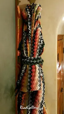 a scarf is hanging on a wall at Riad Gallery 49 & Spa in Marrakech
