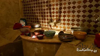 a bunch of bowls on a counter in a kitchen at Riad Gallery 49 & Spa in Marrakech