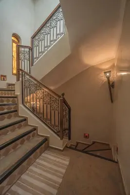 a staircase in a house with a stair case at Riad Dar Attika in Marrakech