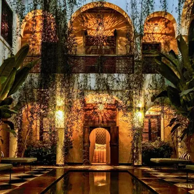 a building with a pool in the middle of it at Sakkan in Marrakech