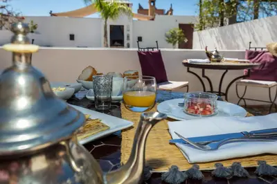 a table with food and drinks on top of it at Maison Manzano in Marrakech