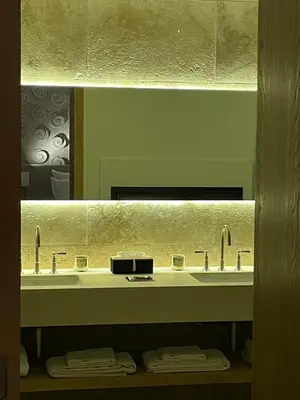 a bathroom with a sink and a mirror at Ksar Char-Bagh Small Luxury Hotels in Marrakech