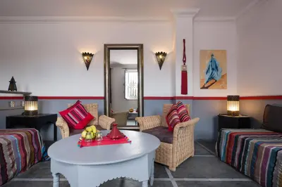 a living room with a couch and a table at Riad Alegria in Marrakech
