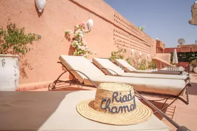 a straw hat sitting on top of a table at Riad Chamali in Marrakech