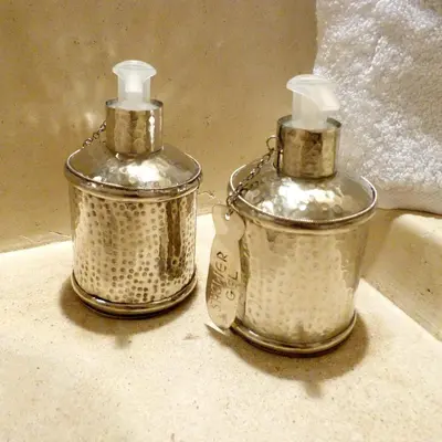 two metal containers sitting on top of a counter at Riad Chamali in Marrakech