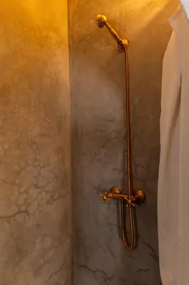 a bathroom with a shower with a shower curtain at Riad Shambala in Marrakech