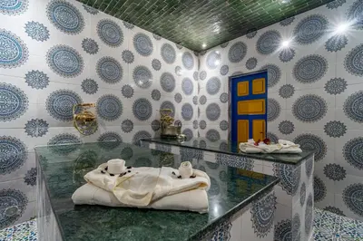a bathroom with a glass counter with towels in it at Maison KA in Marrakech