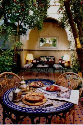 a table with plates of food on top of it at Riad Noga in Marrakech