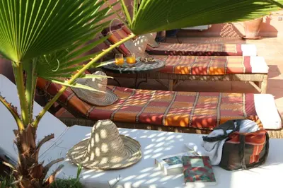 a group of picnic tables with hats on them at Riad Dar Zampa in Marrakech