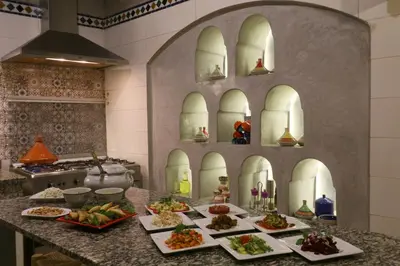 a kitchen with several plates of food on a counter at Ryad El Borj in Marrakech