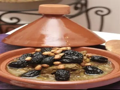 a bowl of food with nuts on top of it at Riad Maison Aicha in Marrakech