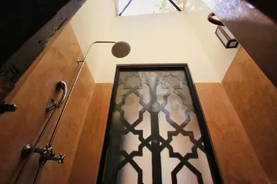 a stairway with a door and a microphone in a room at Riad du Ciel Marrakech in Marrakech