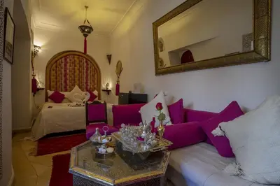 a living room with a couch and a table at Riad Anabel in Marrakech