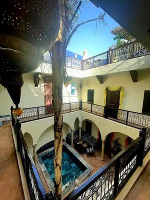 a house with a pool in the middle of it at Riad Rêve d Antan in Marrakech