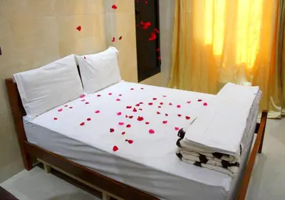 a bed with red hearts on top of it at Miramare Marrakech in Marrakech