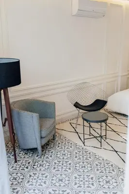 a room with two chairs and a table and a bed at Riad Aïcha Kitchen in Marrakech