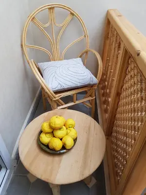 a plate of lemons on a table with a chair at Riad Espressino exclusive Marrakech in Marrakech