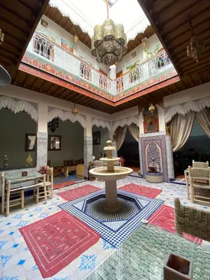 a large room with a ceiling with a chandelier at Riad Mahjouba Marrakech & SPA in Marrakech