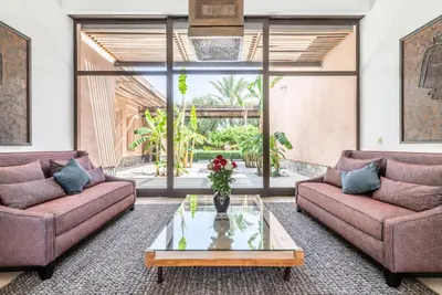 a living room with two couches and a coffee table at Zagora and Marhba villas Marrakech - by EMERALD STAY in Marrakech