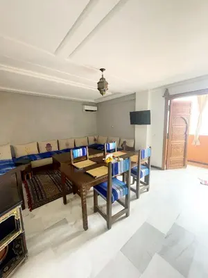 a dining room with a table and chairs at Stylish Moroccan Apartment Gueliz City Centre in Marrakech