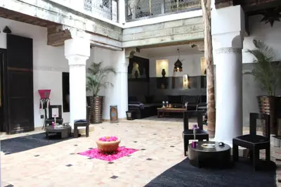 a living room with a couch and a table at Riad Terra Bahia in Marrakech