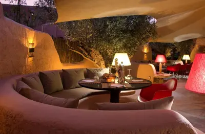 a living room with a couch and a table at Oasis lodges in Marrakech