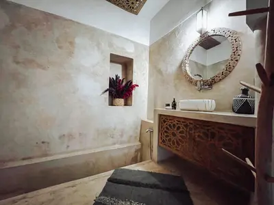 a bathroom with a sink and a mirror at DAR AURORA in Marrakech