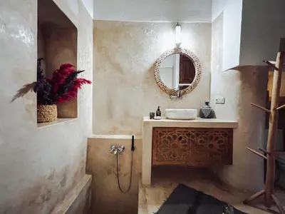 a bathroom with a sink and a mirror at DAR AURORA in Marrakech