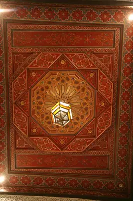 a room with a ceiling with a light on it at Riad Marélia in Marrakech