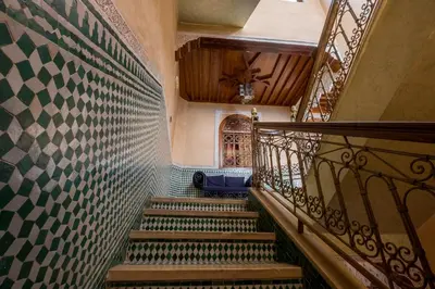 a staircase in a building with a stair railing at Riad Saad in Marrakech
