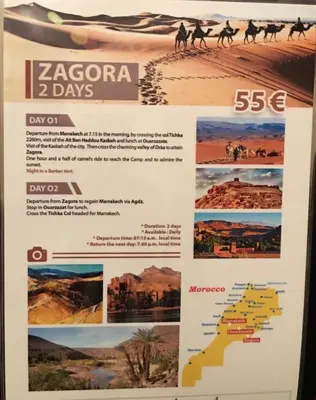 a poster for a camel race in the desert at Ryad Hamza in Marrakech