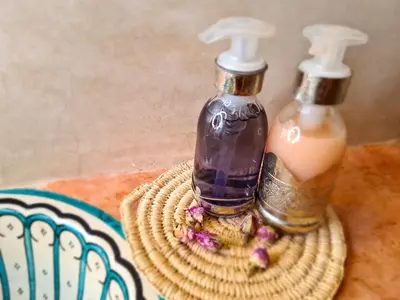 two bottles of soap sitting on top of a table at Riad Casa Sophia in Marrakech