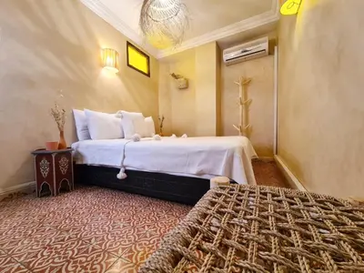 a bedroom with a large bed in a room at Riad Casa Sophia in Marrakech