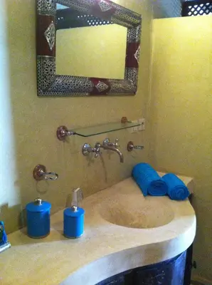 a bathroom with a sink and a mirror at Riad Le Bel Oranger in Marrakech