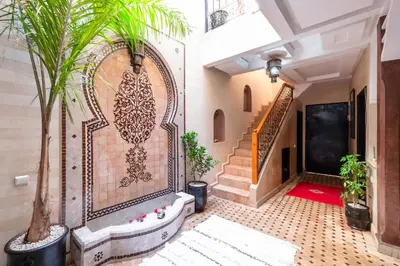 an entrance to a house with a gate and plants at Riad Elite in Marrakech