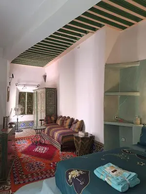 a living room with a couch in a room at RIAD Redous in Marrakech