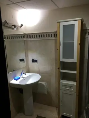 a bathroom with a sink and a mirror at pascal Apartment in Marrakech