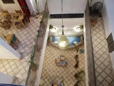 an overhead view of a room with a pool and a ceiling at Riad Papadou in Marrakech