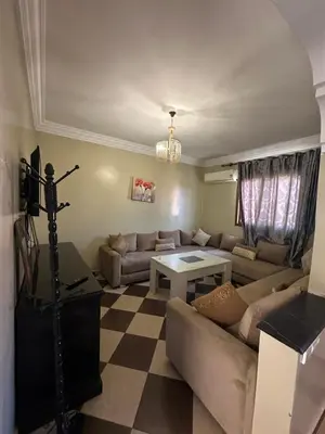 a living room with a couch and a table at Marrakech Family appartements in Marrakech