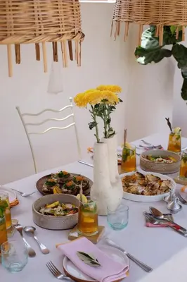a table with plates of food on a table at Riad L'Atelier in Marrakech