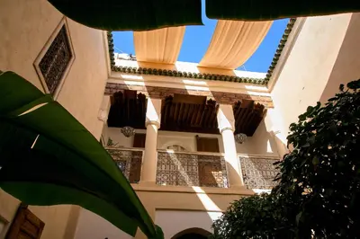 a building with balconies on the side of it at Riad Nomada Marrakech in Marrakech