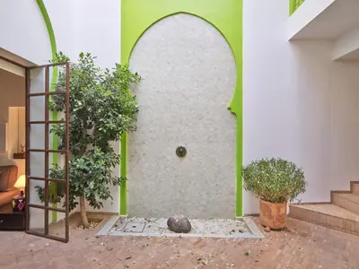 an entrance to a building with a door and plants at Riad Volubilis in Marrakech