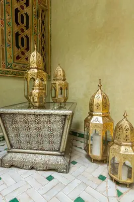 a group of gold domes and lanterns on a floor at Riad AZARO in Marrakech