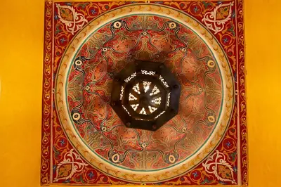 a picture of a clock on a wall at Riad AZARO in Marrakech